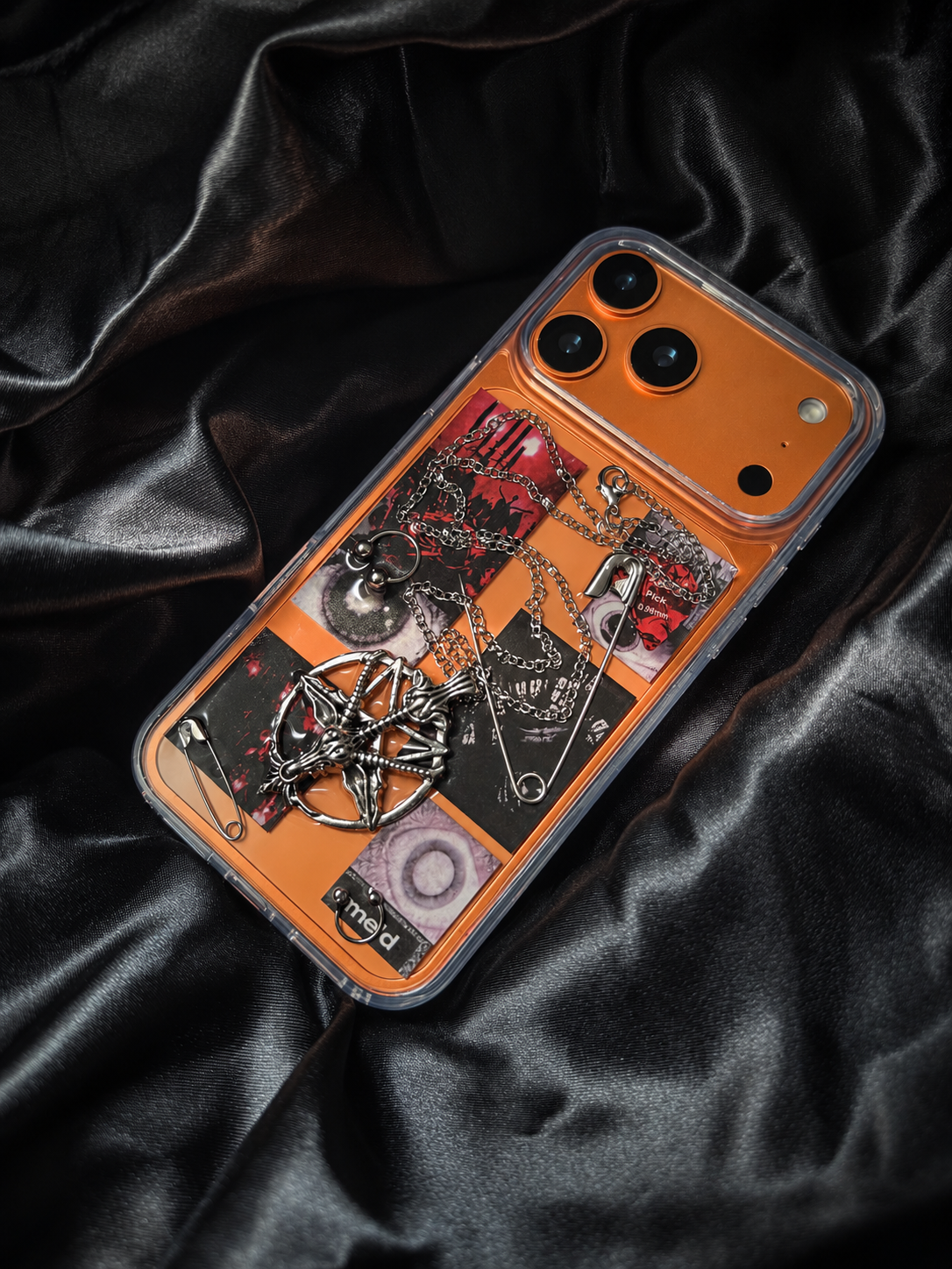 Midnight Relic clear 3D case shown on an orange iPhone